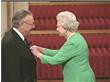 Bob receives his MBE from HM The Queen in 2004